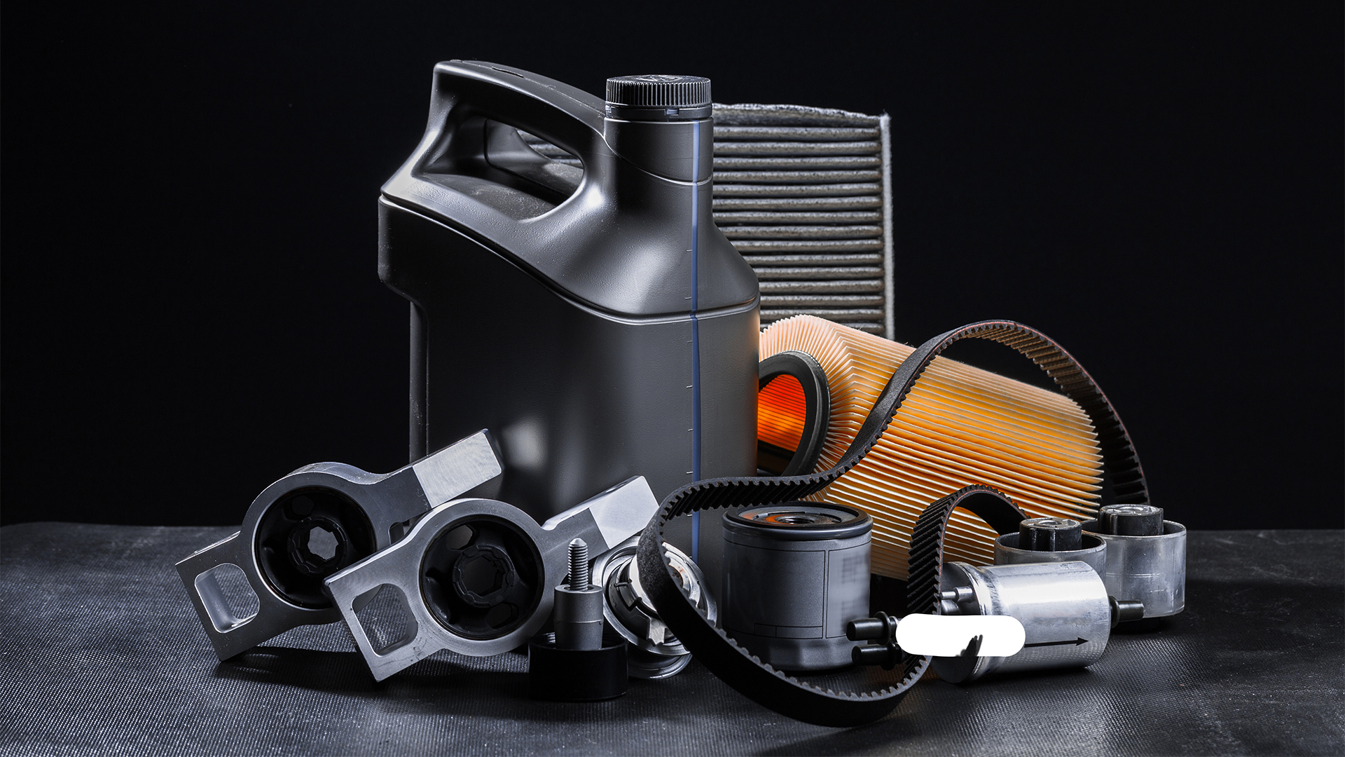 New car parts on a dark background